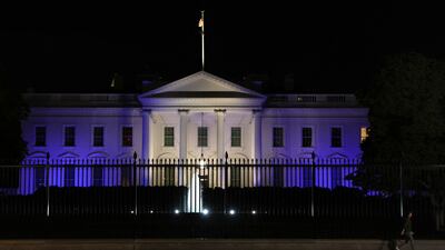 The White House is lit with the colours of the Israeli flag in Washington, on October 9. Reuters