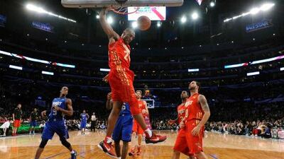 Kobe Bryant of the Los Angeles Lakers dunks during the NBA All Star game.