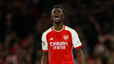 Arsenal's Bukayo Saka celebrates after scoring his penalty during the shootout. Reuters