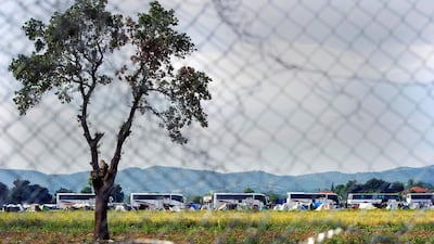 Twenty buses carrying various riot police units were seen heading to the area while a police helicopter observed from above. An estimated 700 police were participating in the operation. Robert Atanasovski / AFP Photo