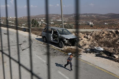 A Palestinian child in the street on the outskirts of Qusra. Reuters
