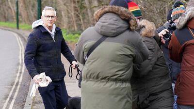Photographers surrounded Match Of The Day host Gary Lineker as he left his home in London on Monday, after it was announced Lineker will return to airwaves after the BBC reversed the former football great's suspension. AP