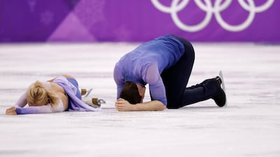 Aljona Savchenko and Bruno Massot of Germany react after finishing their performance in the Pair Skating free skating competition final . Damir Sagolj / Reuters