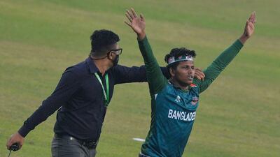A security official removes a Bangladesh supporter from the pitch in Dhaka. AFP