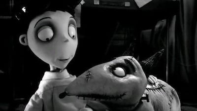 Victor Frankenstein, voiced by Charlie Tahan, with his dog, Sparky, in a scene from Frankenweenie. AP