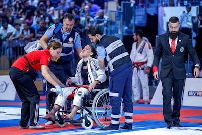 Luiza Monteiro was in pain after sustaining an injury during her loss to Bianca Basilio on Thursday. Victor Besa / The National