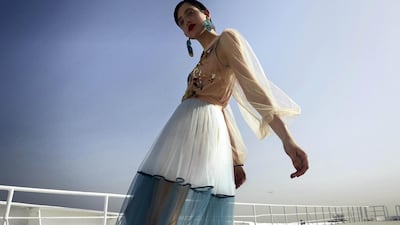 Ship shape: Dress, Dh4,880; earrings, Dh1,879, both from Elisabetta Franchi