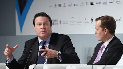 Samer Halawi, left, chief executive at Thuraya, during a panel discussion at Wednesday’s session. Delores Johnson / The National