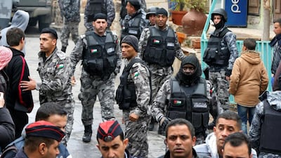 Jordanian policemen leave the vicinity of Karak Castle on December 19, 2016 after carrying out security operations there following a deadly attack a day before. Muhammad Hamed/Reuters