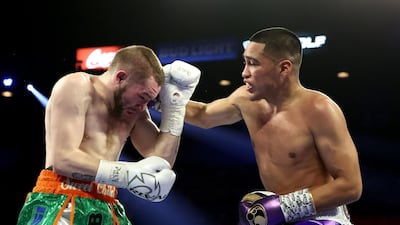 Gabriel Flores Jr. (R) punches Matt Conway during their junior lightweight bout at MGM Grand Garden Arena in Las Vegas. AFP