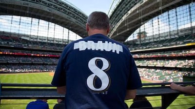 A Milwaukee Brewers fan has the name of the suspended Ryan Braun covered on his shirt. Jeffrey Phelps / AP Photo