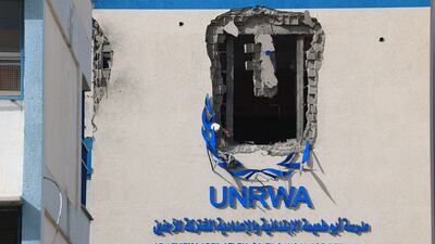 A damaged UNWRA-run school near Khan Younis. If Israel imposes its ban on the refugee agency operating in Gaza, it could lead to starvation, a senior MP has told The National. AFP