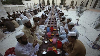 Men pray before breaking their fast on the first day of the holiest month in the Islamic calendar at a mosque in Peshawar, Pakistan on June 29, 2014. Fayaz Aziz/Reuters