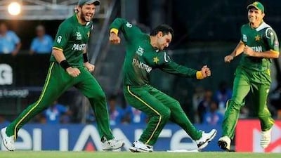 Mohammad Hafeez, centre, was confident Pakistan's bowlers were good enough to stop Australia. Hafeez himself took two wickets. Ishara S Kodikara / AFP