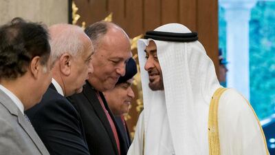 Sheikh Mohammed bin Zayed, Crown Prince of Abu Dhabi and Deputy Supreme Commander of the UAE Armed Forces (R), greets a guest on April 10, 2018, during an official visit to Egypt. Rashed Al Mansoori / Crown Prince Court - Abu Dhabi