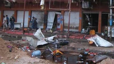Security forces inspect the scene of a suicide bomb attack at a coffee shop in Kirkuk, 290 kilometres north of Baghdad.