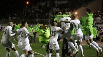Algeria celebrate on Tuesday night after they sealed World Cup qualification. Anis Belghoul / AP