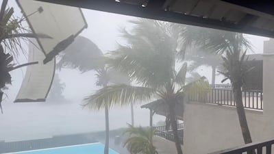 Part of the roof flies off a building as Cyclone Freddy batters Trou-aux-Biches, Mauritius, February 20, 2023 in this still image obtained from social media video. Twitter @PiotrWachowski via REUTERS THIS IMAGE HAS BEEN SUPPLIED BY A THIRD PARTY. MANDATORY CREDIT. NO RESALES. NO ARCHIVES