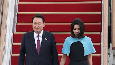 The couple disembark from the presidential plane after returning from Madrid, in July 2022. EPA