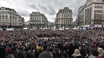 People observe a minute of silence at the Place de la Bourse in central Brussels on March 23, 2016. Martin Meissner/AP Photo