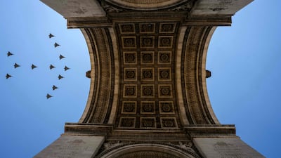 Rafale fighter jets fly over the Arc de Triomphe during a rehearsal, ahead of the Bastille Day parade on the Champs-Elysees avenue in Paris. AFP