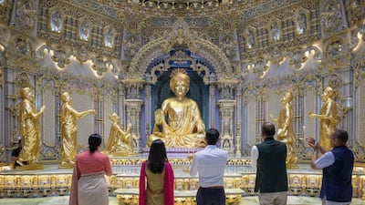 The Sunaks offer prayers at the Swaminarayan Akshardham Hindu temple in New Delhi along with trustees and volunteers from the UK and India. Photo: BAPS.