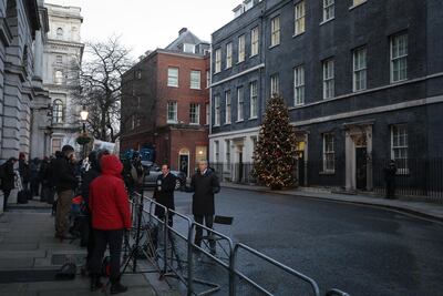 Reporters gather outside 10 Downing Street, home of UK Prime Minister Boris Johnson, to await the unveiling of a historic post-Brexit trade accord. Bloomberg