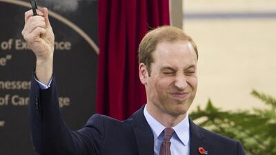 Britain’s Prince William fires a pistol to start a cycling race during a visit to open the new National Cycling Centre of Excellence in Cambridge. Tim Rooke / Reuters