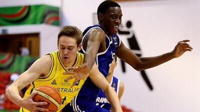 Kyle Clark, left, of Australia and Stephane Gombauld of France jostle for the ball during their Fiba Under 17 World Championship at Al Ahli club in Dubai on August 9, 2014. Satish Kumar / The National