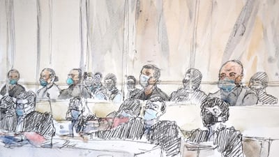 This court sketch made at the Paris courthouse shows the fourteen accused and their lawyers at the opening of the trial. AFP