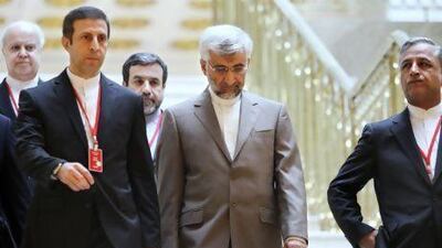 Saeed Jalili, Iran's chief nuclear negotiator, centre, heads an Iranian delegation into talks with world powers on Tuesday. Stanislav Filippov / AP Photo