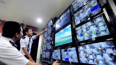 SecurityS monitor CCTV’s at the Ubora Commercial Tower in the Business Bay area in Dubai. Satish Kumar / The National