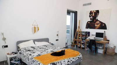 A view of the master bedroom in the apartment with Coca, one of the family's two cats, taking a rest