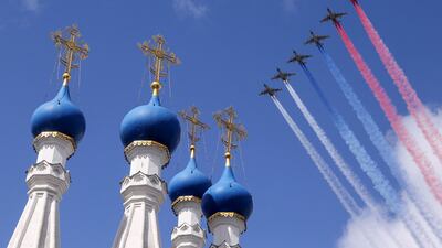 Russian Su-25 jet aircraft release smoke in the colours of the Russian state flag during the rehearsal for the flypast. Reuters