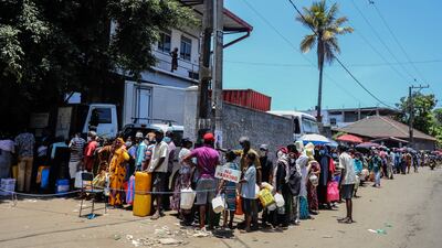 People in Colombo queue to buy fuel, which among other commodities is in short supply in Sri Lanka. EPA