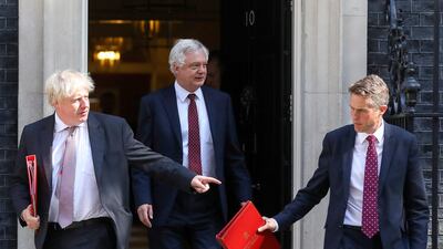 Brexit secretary David Davis, centre, is fighting her over her proposal for a close customs deal with the EU, a person familiar with the matter said. Chris Ratcliffe/Bloomberg