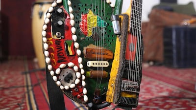 He plays a unique 'tambo-guitar', an instrument he fashioned from a guitar neck and his father's vintage tamboura, a type of lyre played in East Africa. Jaber's invention is embossed with small shells and a map of Africa.