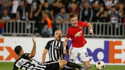 Brandon Williams is fouled by Partizan's Bojan Ostojic, left, and Zoran Tosic in Belgrade. AP