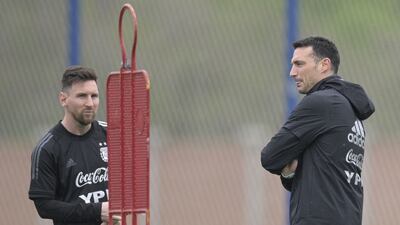 Argentina's coach Lionel Scaloni next to forward Lionel Messi. AFP