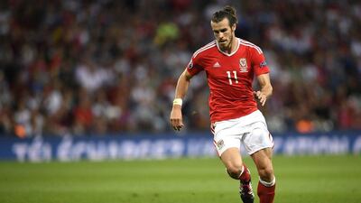 Wales' forward Gareth Bale plays the ball during the Euro 2016 group B football match between Russia and Wales at the Stadium Municipal in Toulouse on June 20, 2016. / AFP / MARTIN BUREAU