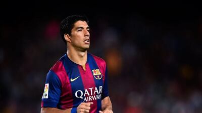 Luis Suarez is banned until October 25 for his bite on Giorgio Chiellini at the 2014 World Cup. He made his Barcelona debut in a friendly on Monday night. David Ramos / Getty Images / August 18, 2014