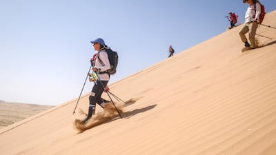 Walkers make a descent down a dune. Courtesy Women’s Heritage Walk