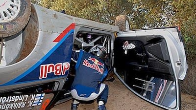 Kimi Raikkonen inspects his car after crashing during yesterday’s shakedown for Rally Spain. So much damage was inflicted to the vehicle that the Finnish driver will not be able to compete in the event, which starts today.