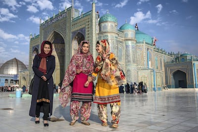 Women wear colourful dresses at the famous Blue Mosque and Shrine of Hazrat Ali in Mazar-e-Sharif, the capital of Balkh province. Stefanie Glinski for The National
