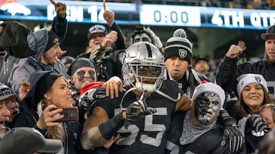 Oakland Raiders linebacker Marquel Lee, centre, celebrates with fans. USA Today Sports