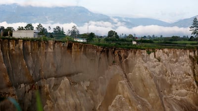 A sinkhole that opened in Pondok Balik village, in Indonesia. EPA