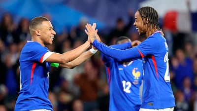 Kylian Mbappe celebrates after scoring the third goal during the match between France and Luxembourg. EPA