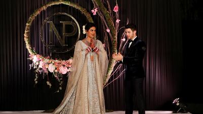 Newlyweds Priyanka Chopra, 36, and Nick Jonas, 26, pose for a photograph during a reception at a hotel in New Delhi on December 4, 2018. Photo: Reuters