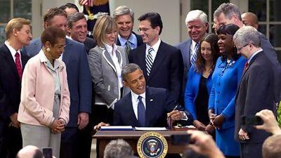 President Barack Obama signs the Jumpstart our Business Startups (JOBS) Act. AP Photo / Carolyn Kaster