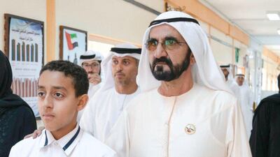 Sheikh Mohammed bin Rashid, Vice President and Ruler of Dubai, visits Khalifa Al Kaabi at Al Qudwa School to thank him for saving his schoolmates after their bus caught fire. Courtesy Dubai Media Office